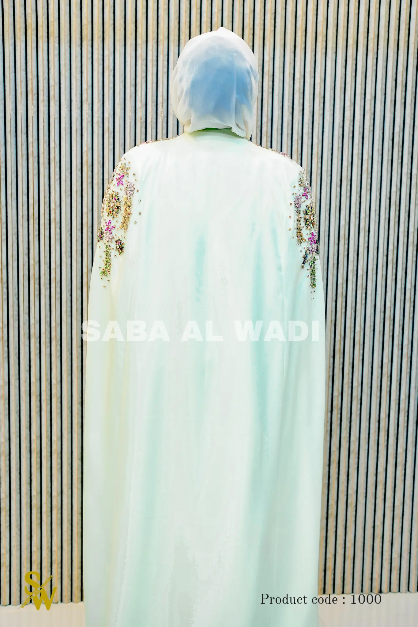 Rear view of the Shalimar Cave Abaya featuring the dramatic cape sleeve design and rich, structured fabric that holds its shape beautifully.
