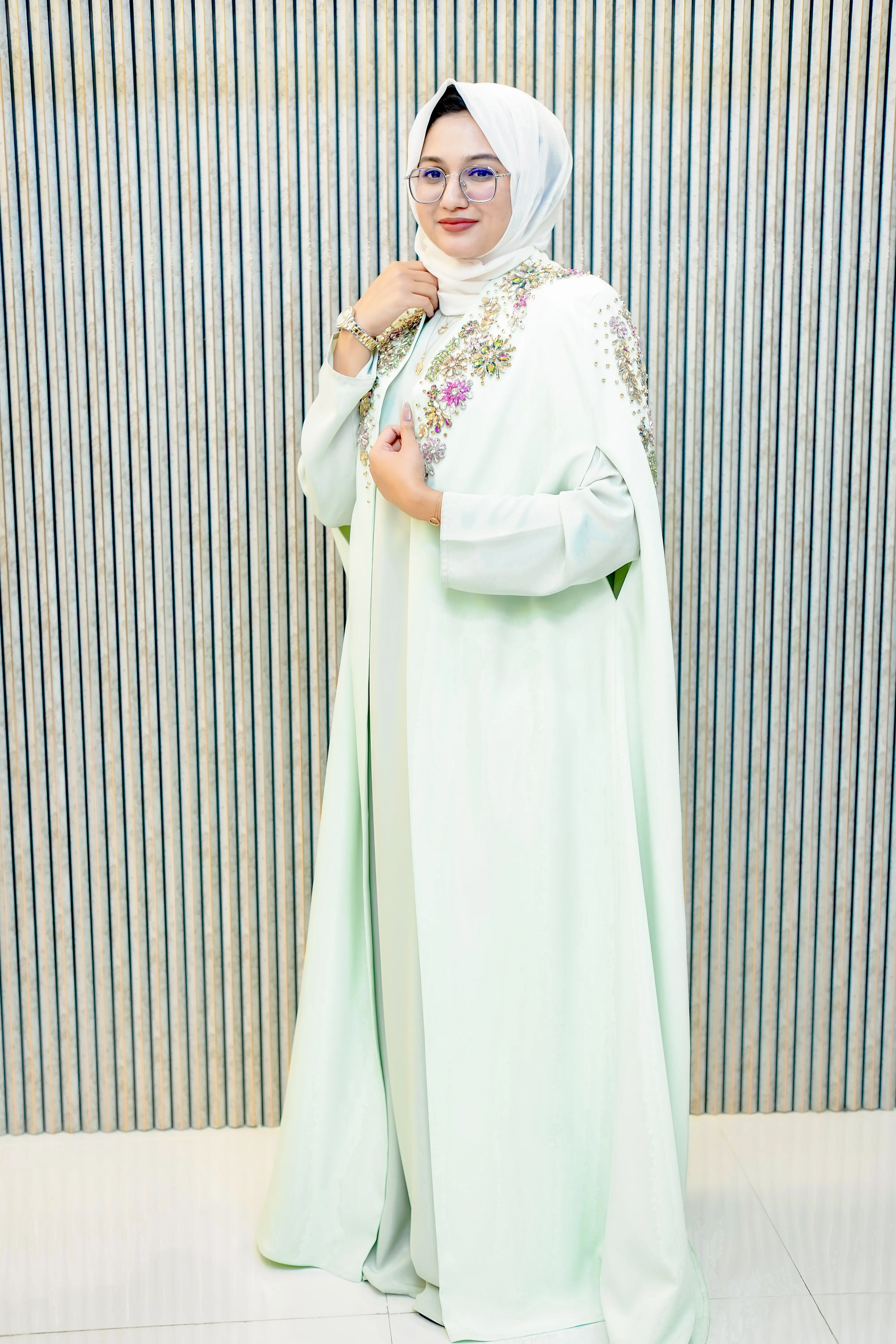 Full-length view of the Shalimar Cave Abaya in Pastel Green Barbie Crepe, showcasing the elegant flowy silhouette and matching inner slip dress from the best abaya shop in Dubai.