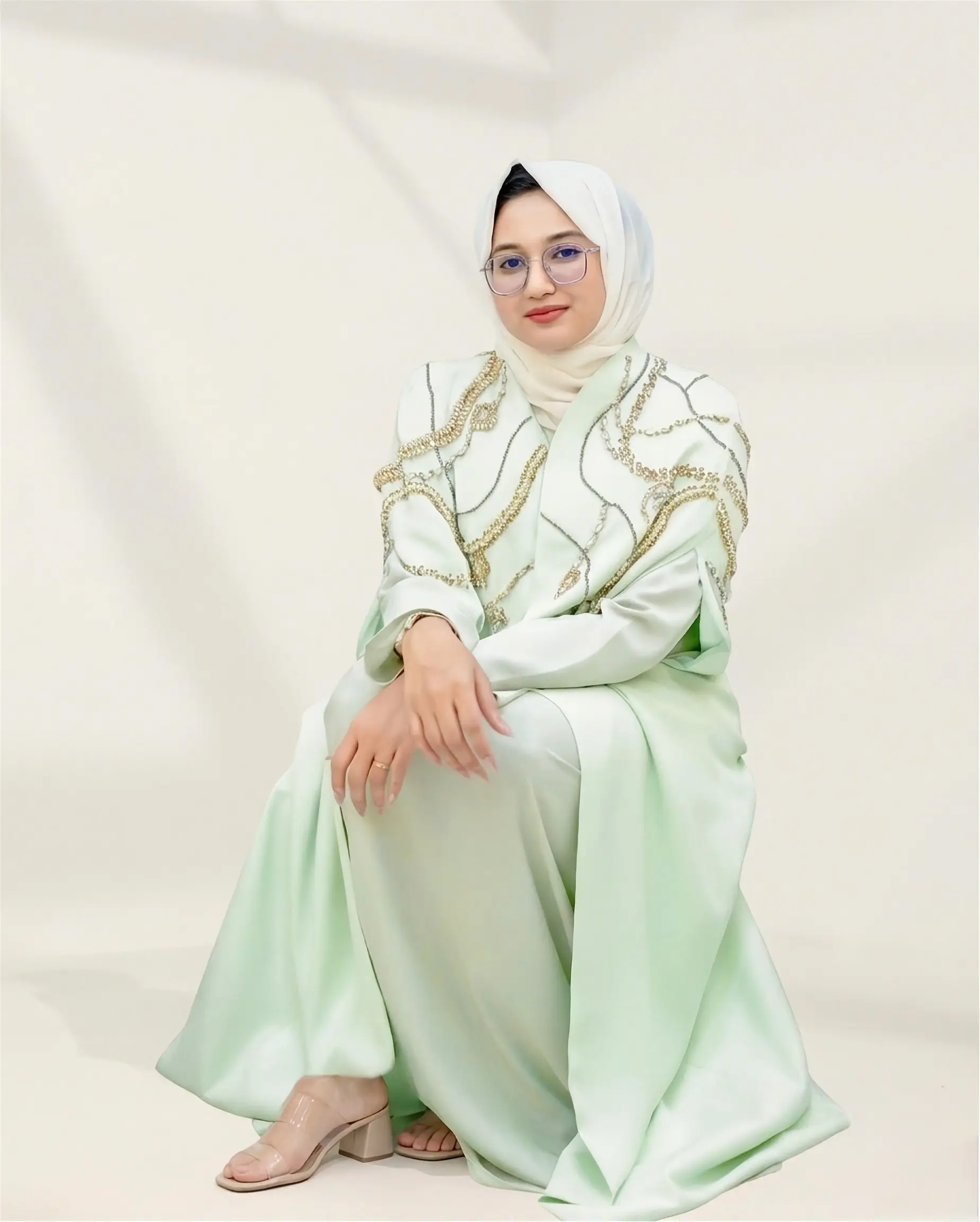 Introducing the Naoumi Reeves Barbie Crepe Cape Abaya: The Pinnacle of Luxury Modest Wear When it comes to high-end modest fashion, few pieces capture the essence of regal sophistication quite like the image 2