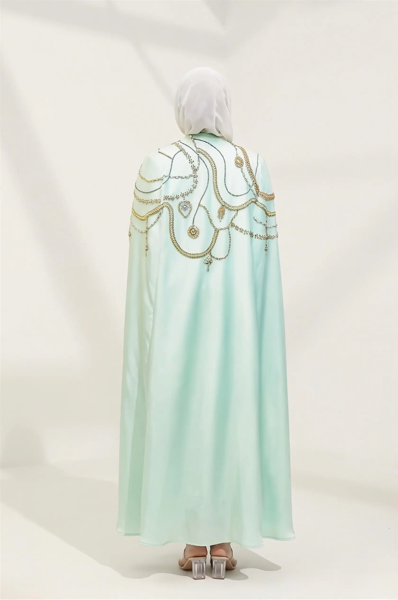 Introducing the Naoumi Reeves Barbie Crepe Cape Abaya: The Pinnacle of Luxury Modest Wear When it comes to high-end modest fashion, few pieces capture the essence of regal sophistication quite like the image 3
